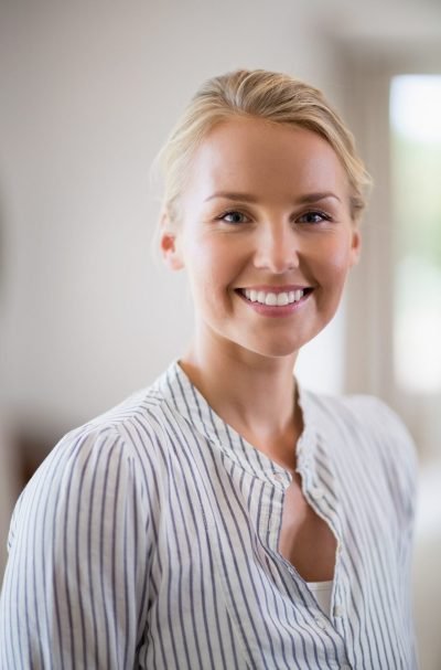 beautiful-woman-smiling-at-home-e1779793798672